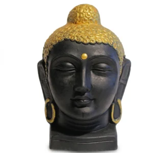 Front view of a matte black Buddha head statue with gold crown and earrings on a white background