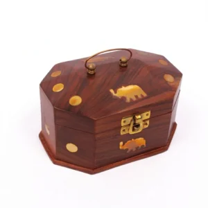 Closed front view of a square wooden box with a brass sunburst inlay and flip latch