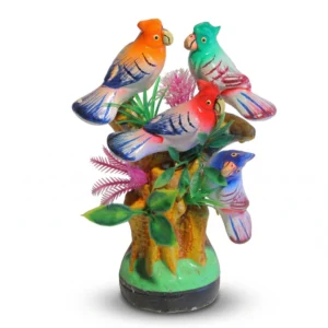 A colorful figurine featuring four hand-painted parrots in orange, teal, red, and blue on a tree trunk