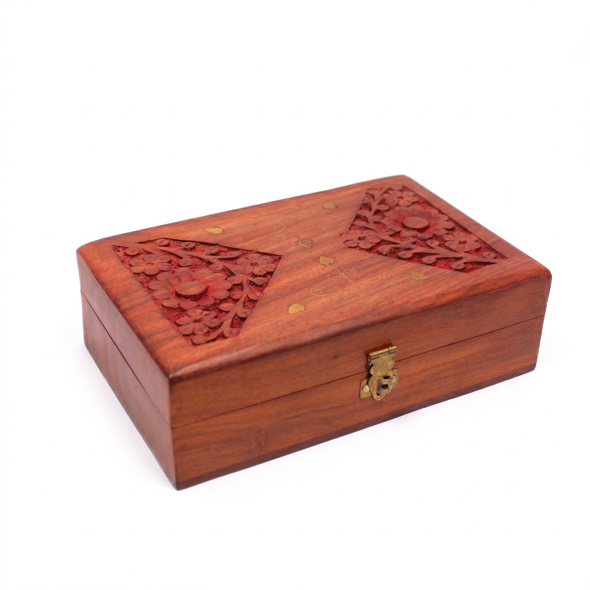 Front view of a closed wooden box with symmetrical floral carvings and brass flip latch