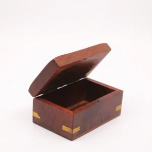 Closed view of a handcrafted wooden box featuring a golden brass elephant inlay on the lid