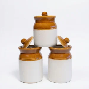 A stacked pyramid arrangement of three 250ml dual-tone ceramic jars with brown glazed tops and cream bases, showing the complete 3-piece set.