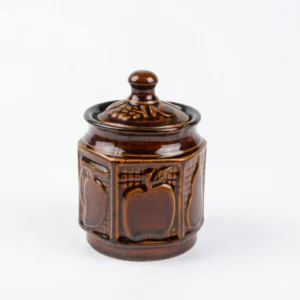 A handcrafted 300ml dual-tone ceramic storage jar with a glossy brown top and cream base, standing on a white background with its matching lid.