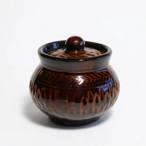 A modern spherical 300ml ceramic storage jar with a glossy brown top and cream base, standing on a white background with its matching lid.