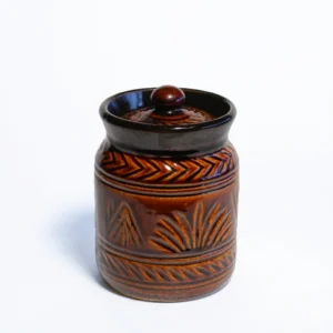 A handcrafted 500ml tall ceramic barnie jar with a glossy brown upper half and cream base, standing on a white background with its matching lid.