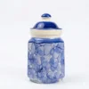 A traditional ceramic barnie pickle jar featuring a unique blue and white bubble-patterned glaze and a solid cobalt blue lid, isolated on a white background.