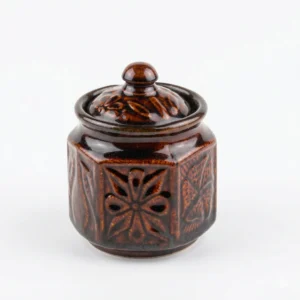 A 300ml cream-white ceramic storage jar with a hand-painted brown floral motif and a solid brown lid, isolated on a white background.