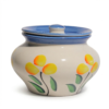 A cream-colored ceramic storage jar with a wide-bellied shape, featuring hand-painted yellow flowers and a blue-rimmed lid, isolated on a white background.