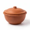 Handcrafted natural clay cooking pot with lid for traditional recipes.