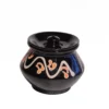 Front view of Givieo black glossy ceramic pot with lid featuring hand-painted white and orange wave patterns.