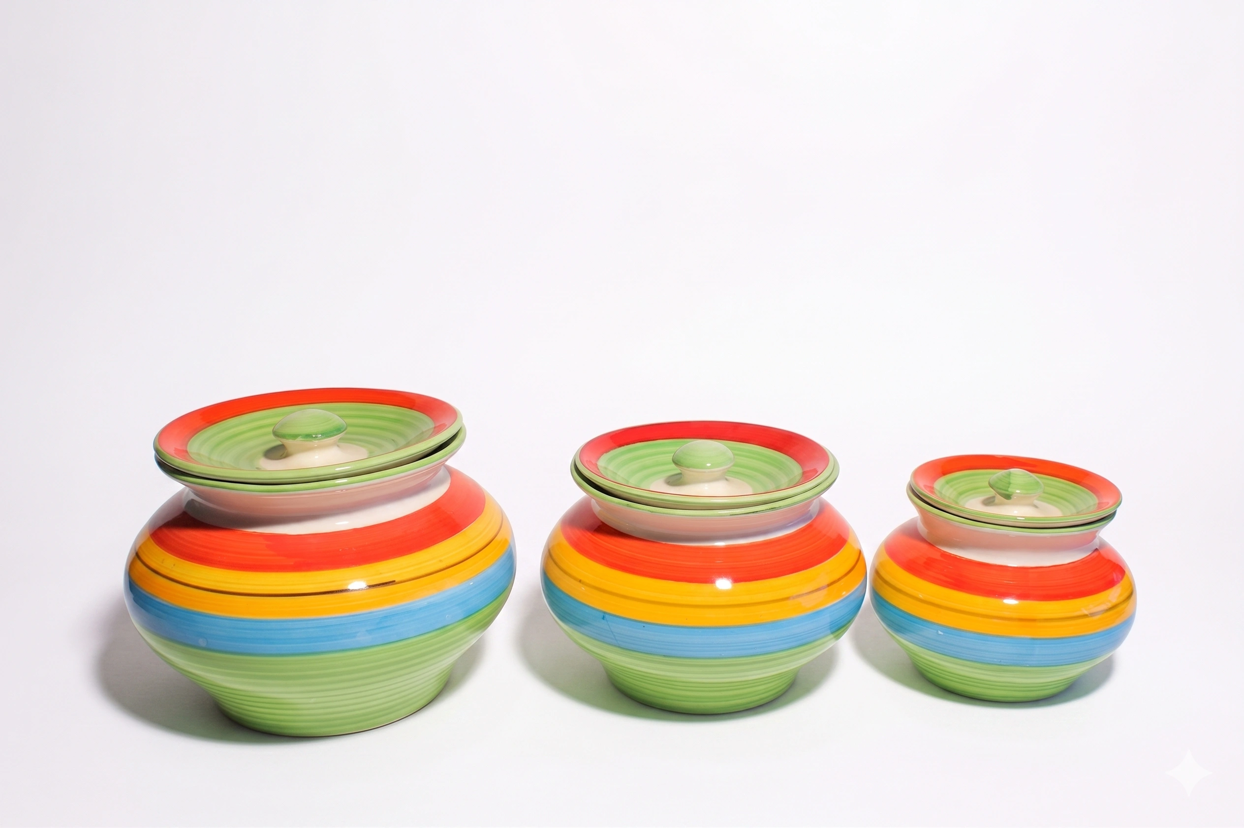 Front view of 3-piece Givieo rainbow horizon ceramic jar set stacked vertically.