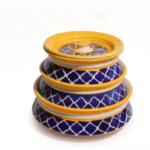 Front view of Givieo white ceramic jar with hand-painted indigo blue leaf patterns and matching lid.