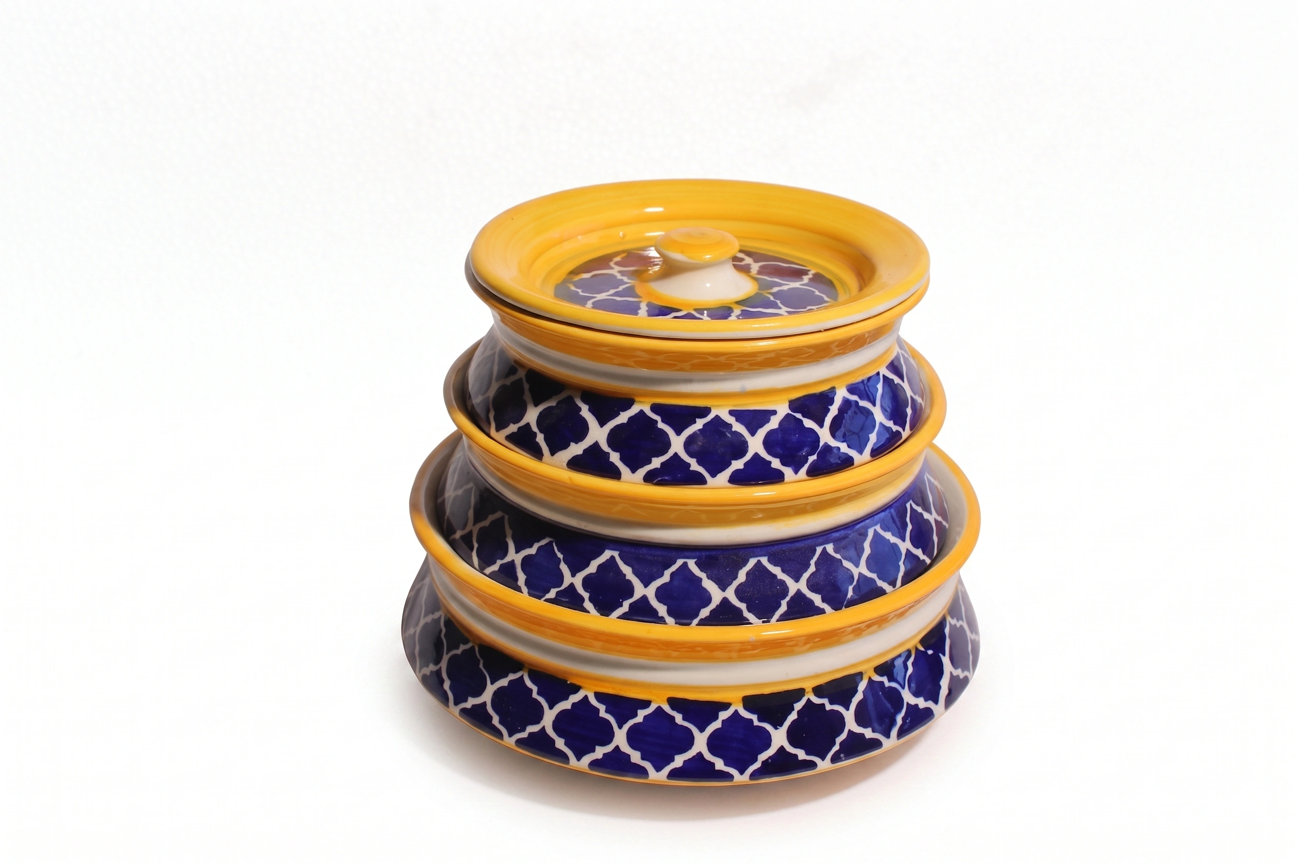Front view of Givieo white ceramic jar with hand-painted indigo blue leaf patterns and matching lid.
