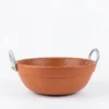 Authentic red terracotta kadai chatti filled with steaming fish curry and green chilies.